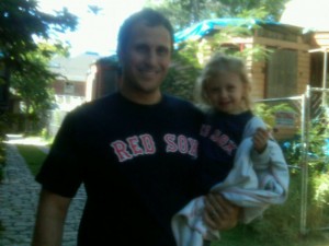 Daddy and daughter in Red Sox shirts