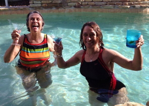 Me and my mom in a pool with martinis